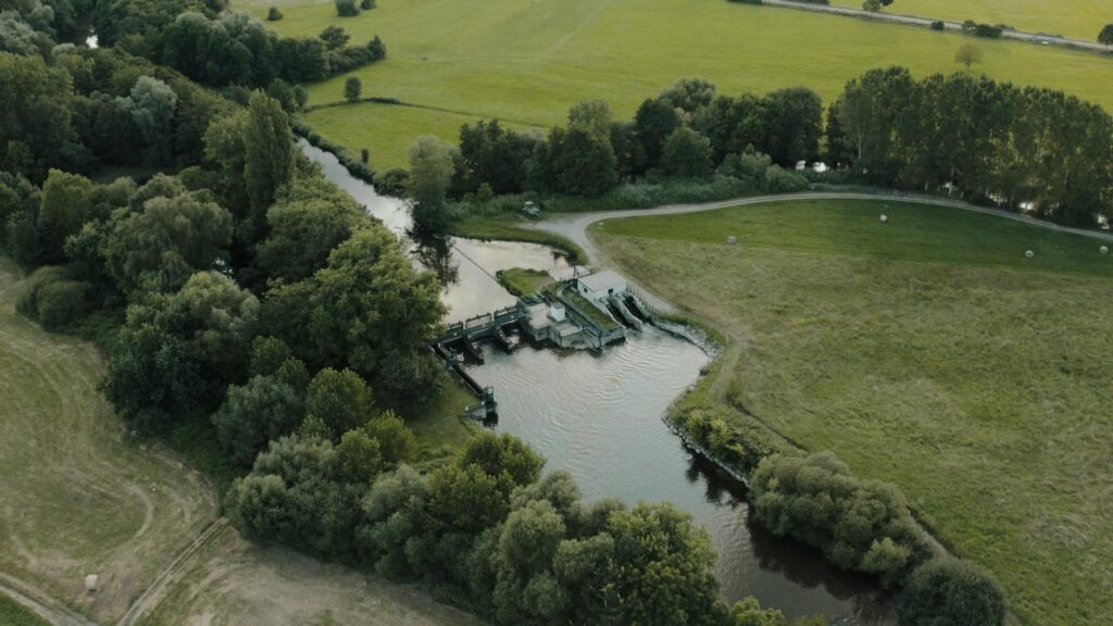 aerial view of river lock in scenic countryside